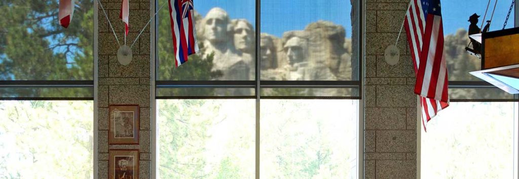 window shades with mount rushmore in the background